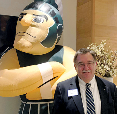 Interim Dean Freeman with Sparty