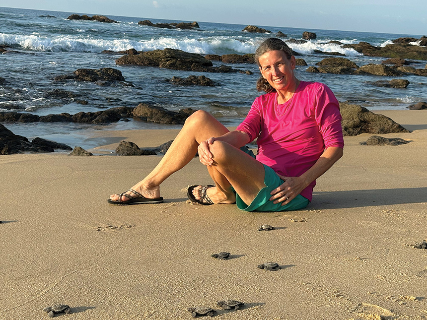 Harris on a Oaxaca beach beside newly-hatched sea turtles.