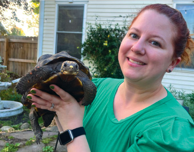 Dr. Machniak holding a turtle.
