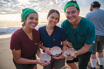 students holding tutles